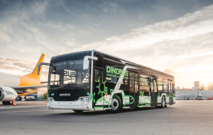 Side view of airport apron bus in front of airport